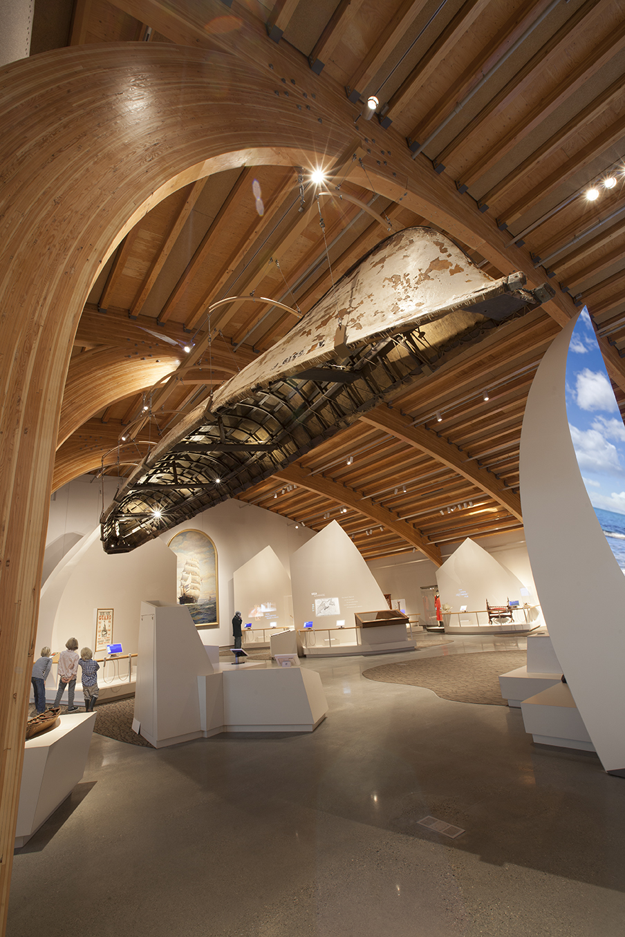 To relate to the gallery height, McMillan Group flew the 30’ Arctic umiak boat, creating an unusual display feature.